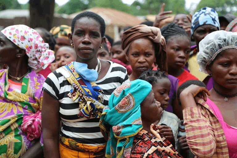Women gathered for a general food distribution to displaced people from Palma in Mueda in Mozambique