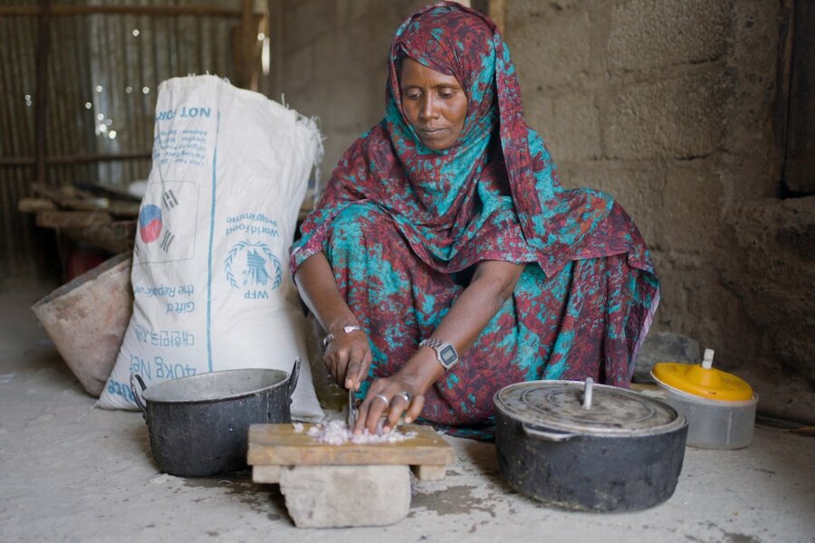 Aisha complements the rice with vegetables she buys with the cash transfers from WFP. Photo: WFP/Filimon Mekonnen